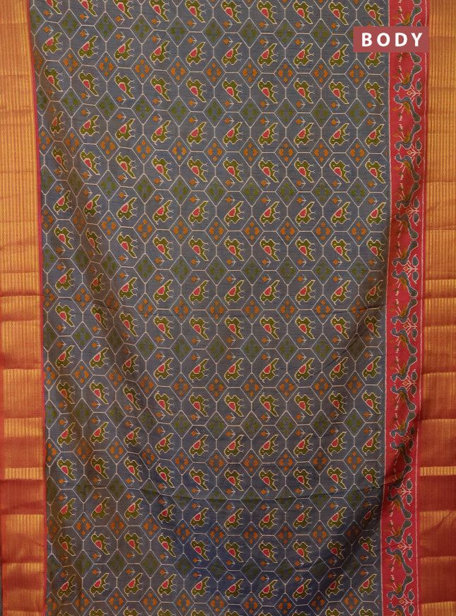 Semi tussar saree dual shade of bluish grey and rust shade with allover patola prints and zari woven border