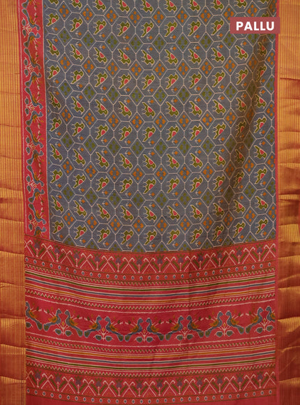 Semi tussar saree dual shade of bluish grey and rust shade with allover patola prints and zari woven border