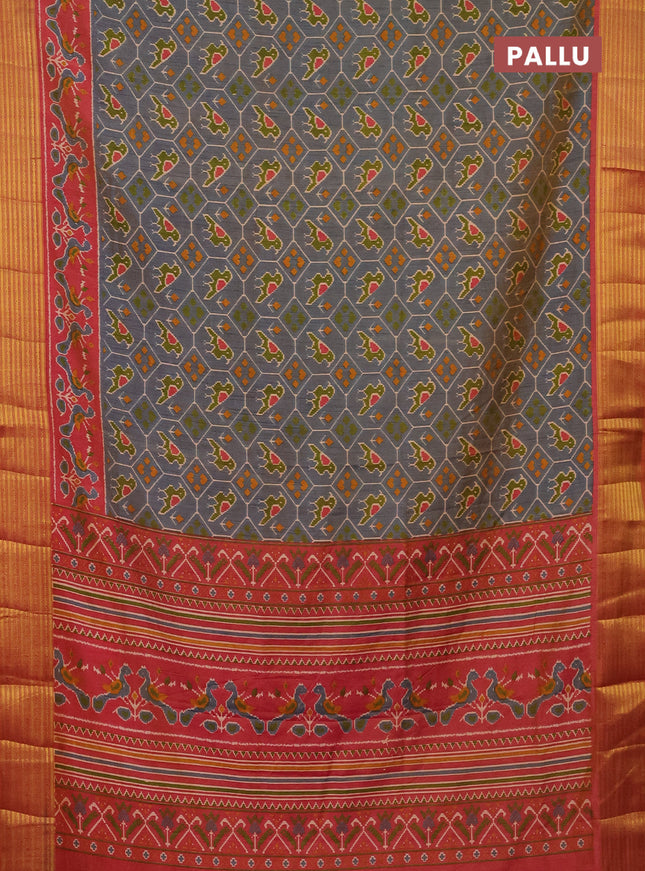 Semi tussar saree dual shade of bluish grey and rust shade with allover patola prints and zari woven border