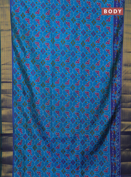 Semi tussar saree cs blue and blue with allover patola prints and zari woven border