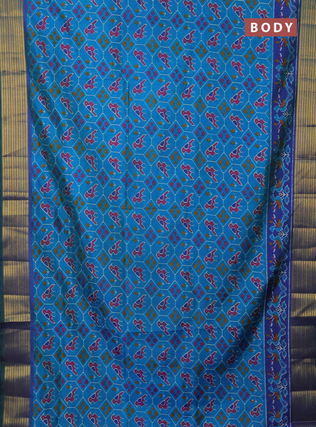 Semi tussar saree cs blue and blue with allover patola prints and zari woven border