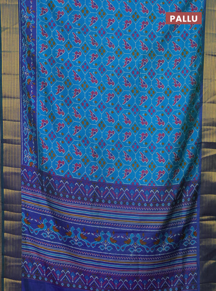 Semi tussar saree cs blue and blue with allover patola prints and zari woven border