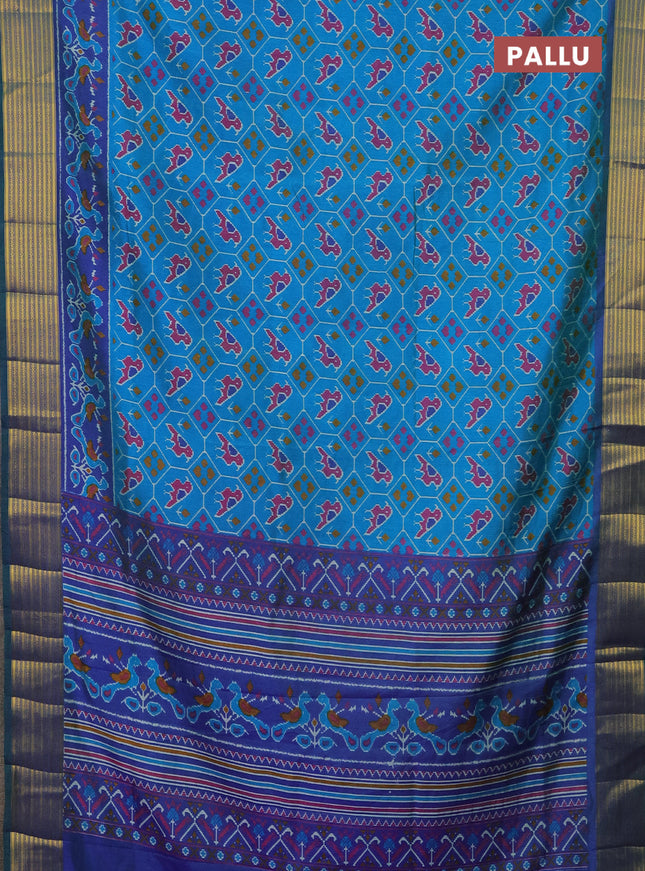 Semi tussar saree cs blue and blue with allover patola prints and zari woven border