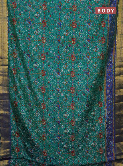 Semi tussar saree teal green and blue with allover patola prints and zari woven border