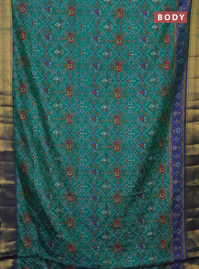 Semi tussar saree teal green and blue with allover patola prints and zari woven border