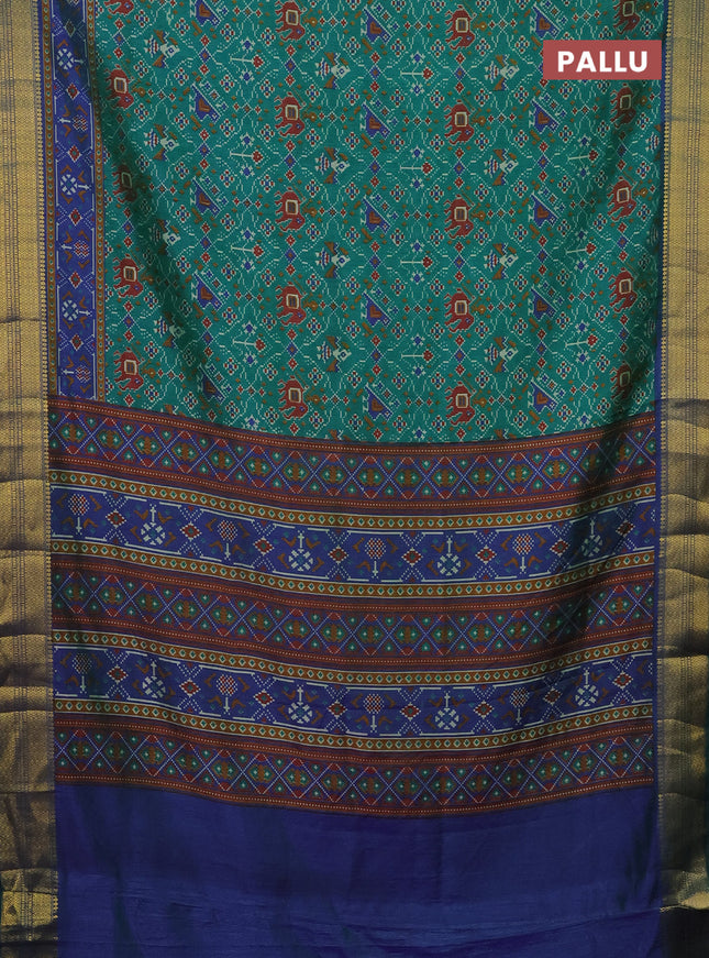 Semi tussar saree teal green and blue with allover patola prints and zari woven border
