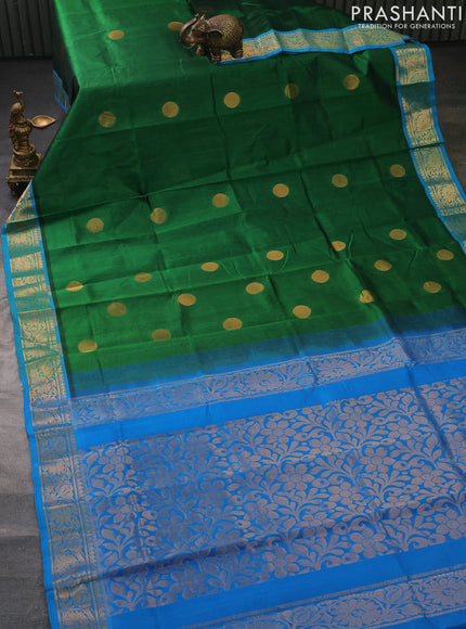 Silk cotton saree green and cs blue with zari woven geometric buttas and rich zari woven border