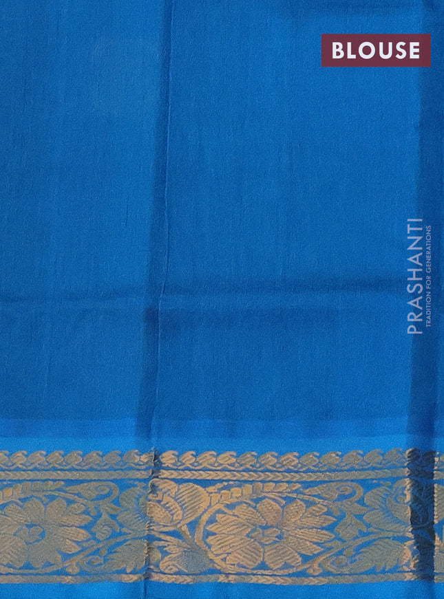 Silk cotton saree green and cs blue with zari woven geometric buttas and rich zari woven border