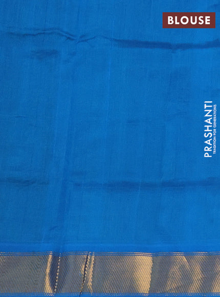 Silk cotton saree green and cs blue with zari woven floral buttas and zari woven border