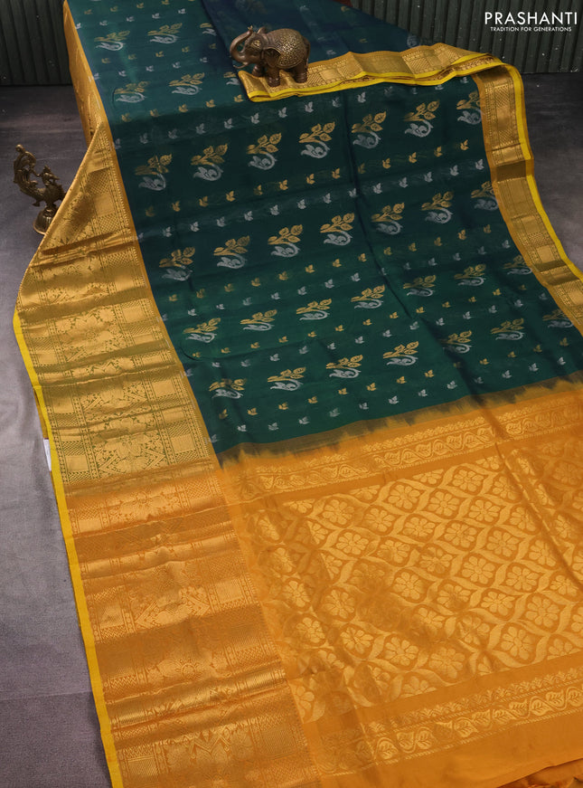 Silk cotton saree dual shade of green and mustard yellow with allover silver & gold zari woven buttas and long rich zari woven border