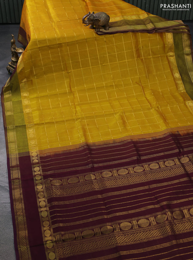 Silk cotton saree mustard yellow and wine shade with allover zari checked pattern and rettapet zari woven border