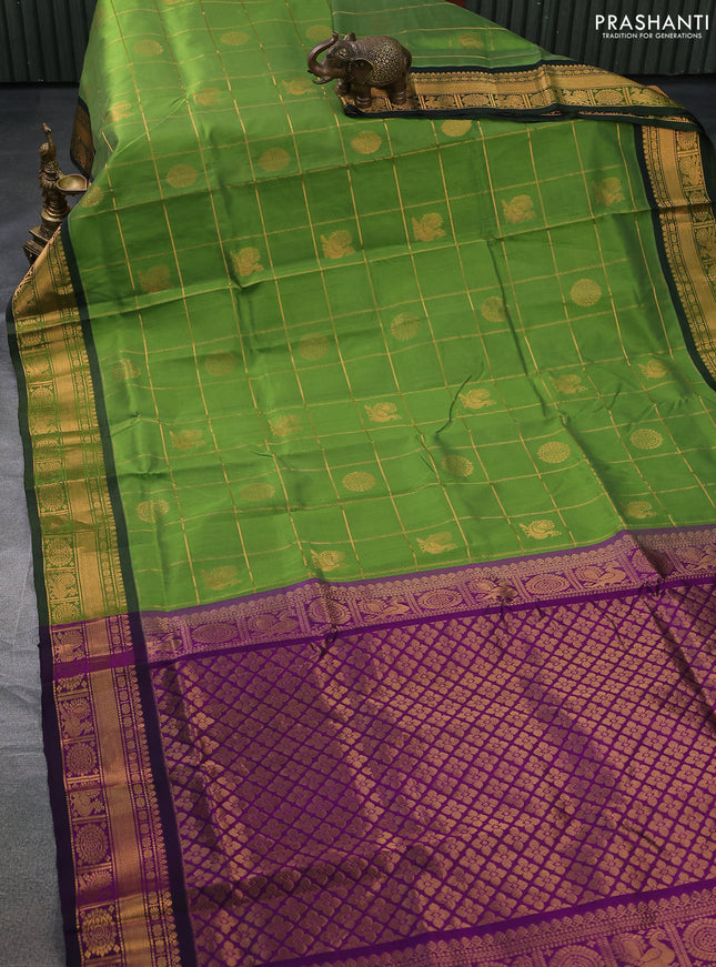 Silk cotton saree green and purple with allover zari checked pattern and rich zari woven border