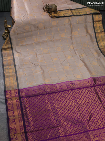 Silk cotton saree beige and purple with allover zari checks & buttas and zari woven border