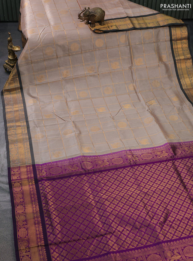Silk cotton saree beige and purple with allover zari checks & buttas and zari woven border
