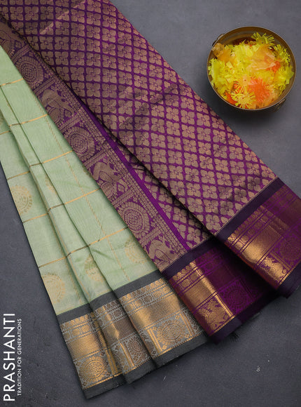 Silk cotton saree pista green and purple with allover zari checks & buttas and zari woven border