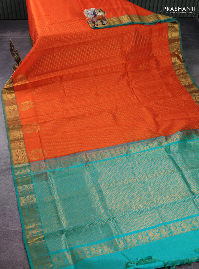 Silk cotton saree orange and teal green with allover zari checked pattern and rich zari woven border