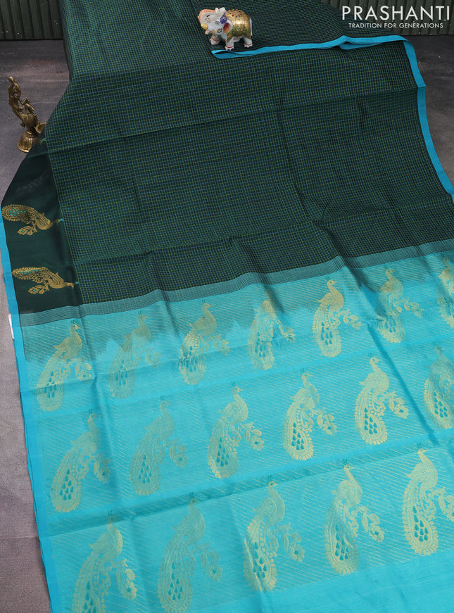 Silk cotton saree bottle green and teal blue with allover thread checked pattern and peacock design zari woven butta border