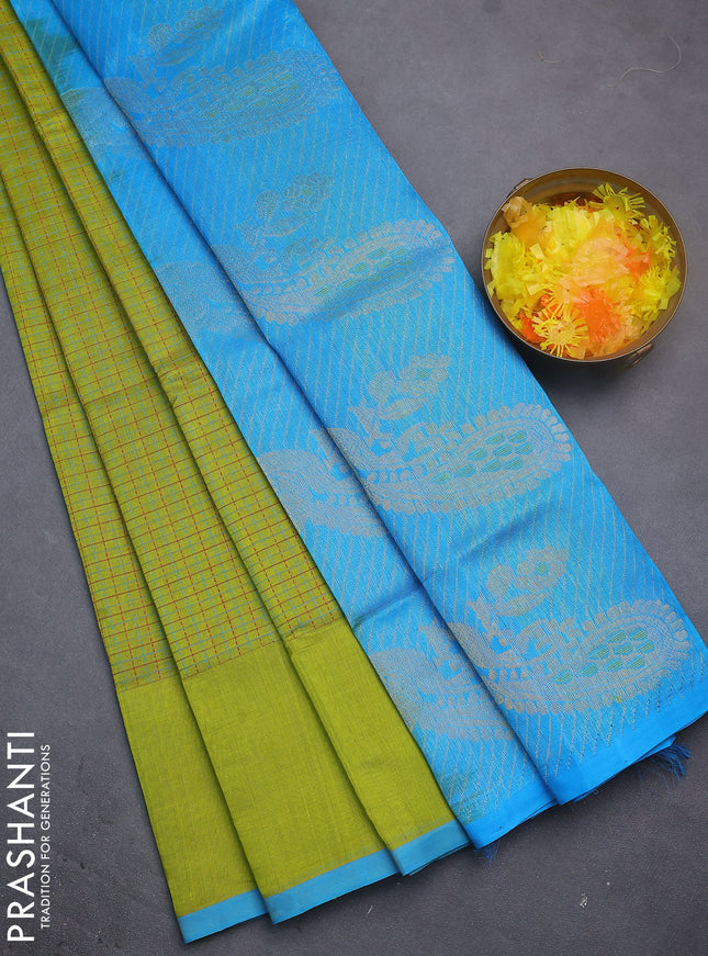 Silk cotton saree lime green and cs blue with allover thread checked pattern and peacock design zari woven butta border