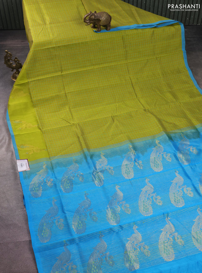 Silk cotton saree lime green and cs blue with allover thread checked pattern and peacock design zari woven butta border
