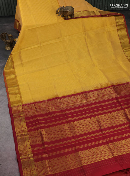 Silk cotton saree yellow shade and maroon with allover lakshadeepam weaves and zari woven border