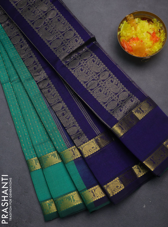 Silk cotton saree teal green and navy blue with allover lakshadeepam weaves and rettapet zari woven border