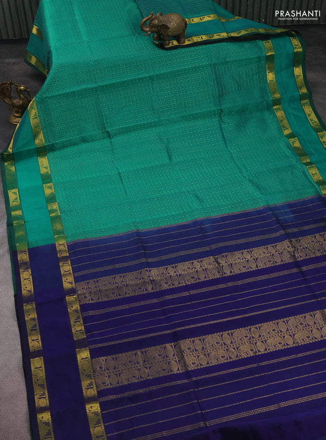 Silk cotton saree teal green and navy blue with allover lakshadeepam weaves and rettapet zari woven border
