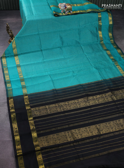Silk cotton saree teal blue and black with allover lakshadeepam weaves and rettapet zari woven border