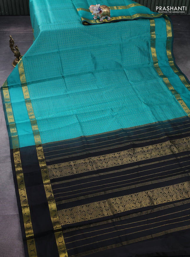 Silk cotton saree teal blue and black with allover lakshadeepam weaves and rettapet zari woven border