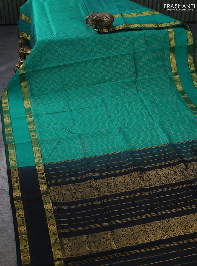 Silk cotton saree teal green and black with allover lakshadeepam weaves and rettapet zari woven border