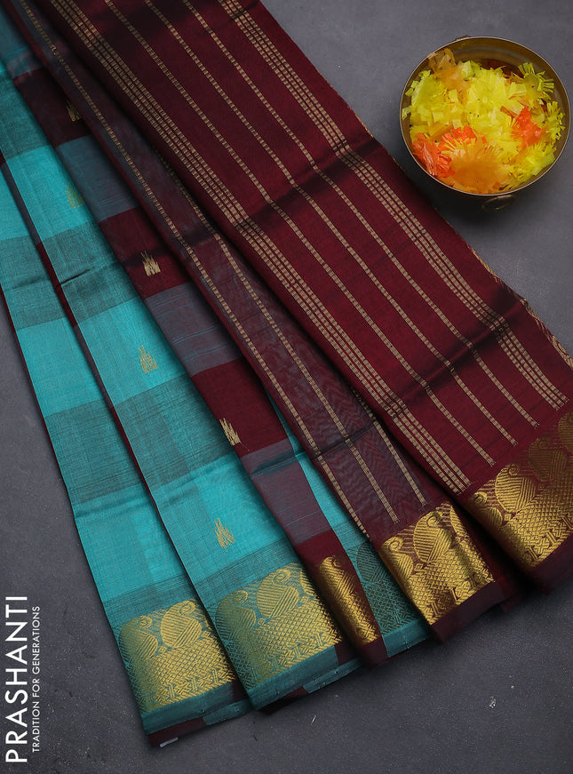Silk cotton saree teal blue and deep maroon with allover paalum pazhamun checks & zari buttas and paisley & annam zari woven border