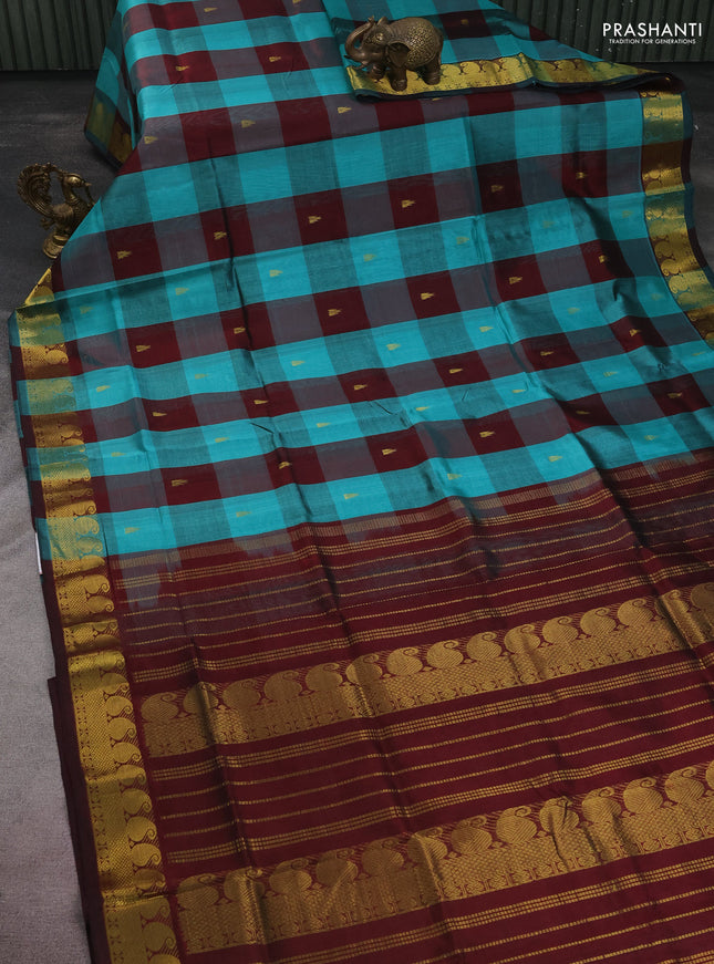 Silk cotton saree teal blue and deep maroon with allover paalum pazhamun checks & zari buttas and paisley & annam zari woven border