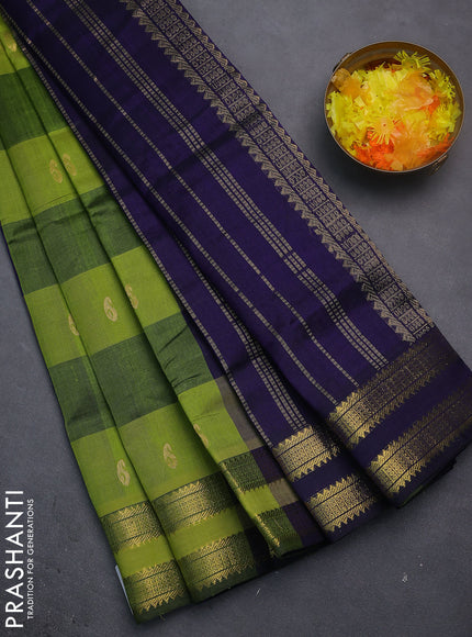 Silk cotton saree light green and blue with allover paalum pazhamun checks & zari buttas and rettapet zari woven border