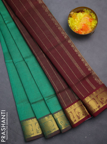 Silk cotton saree green and maroon with allover vairosi pattern and annam & elephant zari woven border