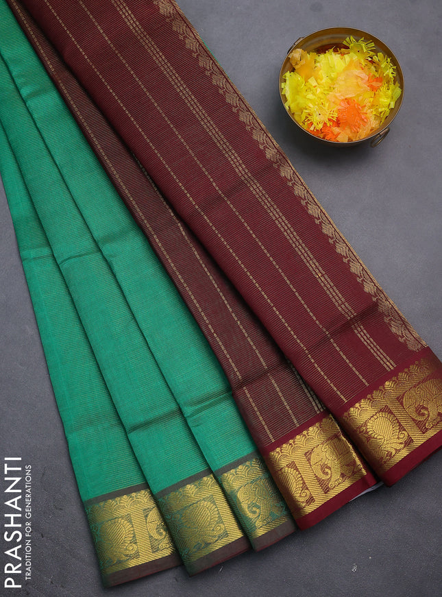 Silk cotton saree green and maroon with allover vairosi pattern and annam & elephant zari woven border