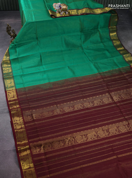 Silk cotton saree green and maroon with allover vairosi pattern and annam & elephant zari woven border