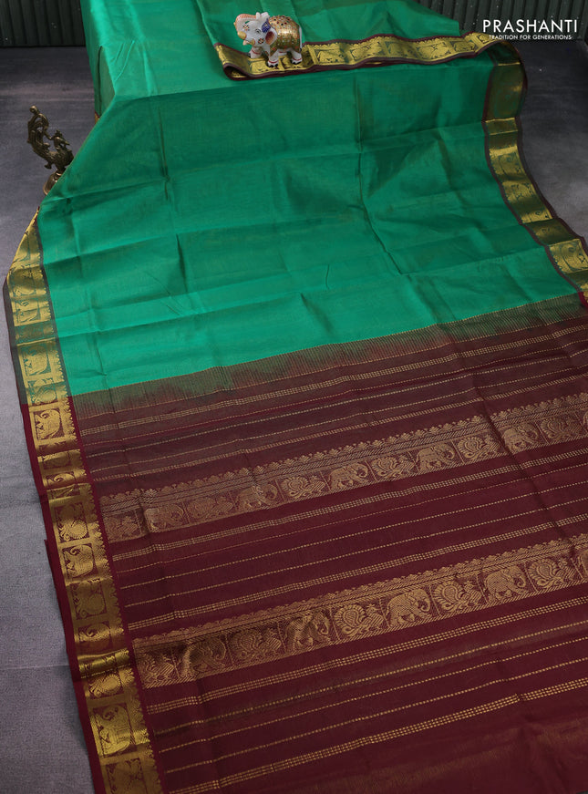 Silk cotton saree green and maroon with allover vairosi pattern and annam & elephant zari woven border