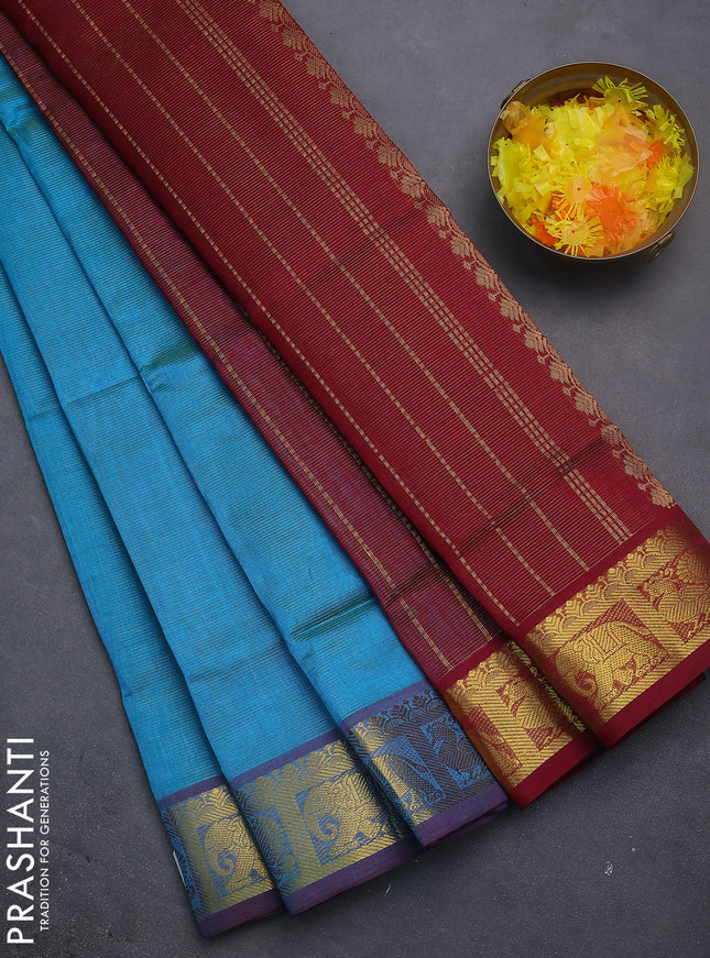 Silk cotton saree teal blue and maroon with allover vairosi pattern and zari woven border