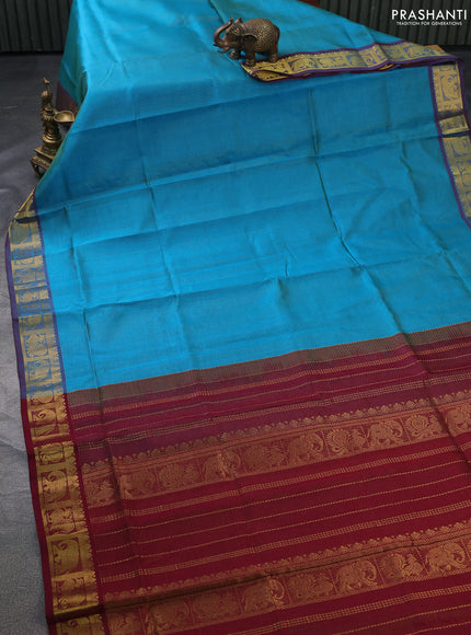 Silk cotton saree teal blue and maroon with allover vairosi pattern and zari woven border