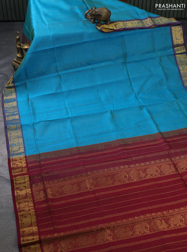 Silk cotton saree teal blue and maroon with allover vairosi pattern and zari woven border