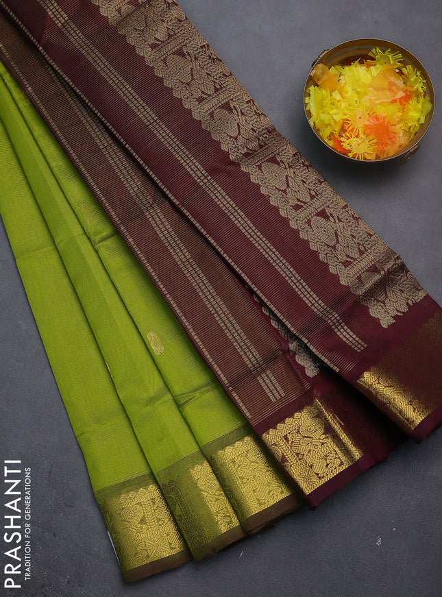 Silk cotton saree light green and coffee brown with allover vairosi weaves & buttas and rich zari woven border