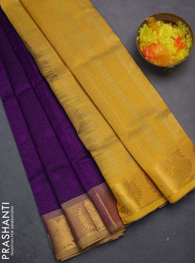 Silk cotton saree purple and yellow with allover self emboss jacquard and annam & rudhraksha zari woven border