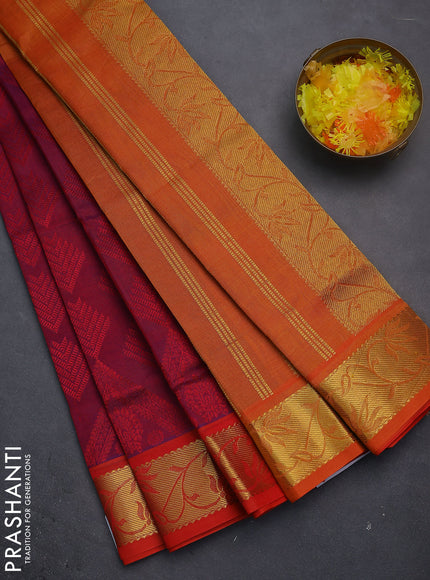 Silk cotton saree dual shade of reddish purple and orange with allover self emboss jacquard and zari woven border