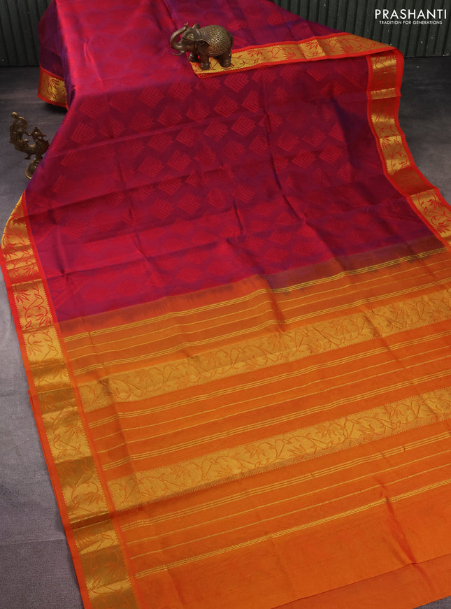 Silk cotton saree dual shade of reddish purple and orange with allover self emboss jacquard and zari woven border