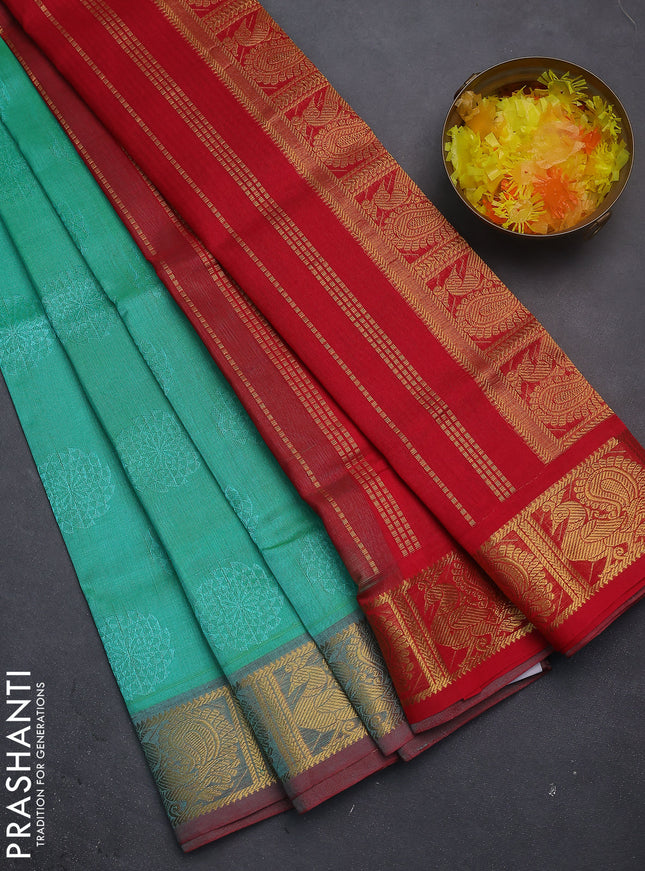 Silk cotton saree teal green shade and red with allover self emboss jacquard and annam zari woven border