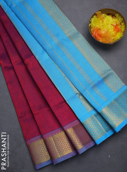 Silk cotton saree dual shade of maroon and blue with allover self emboss jacquard and zari woven border