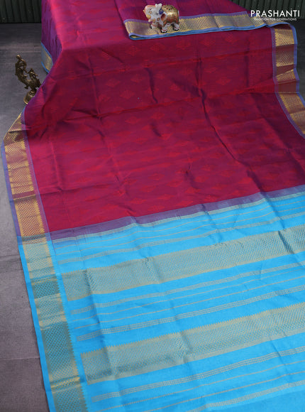 Silk cotton saree dual shade of maroon and blue with allover self emboss jacquard and zari woven border