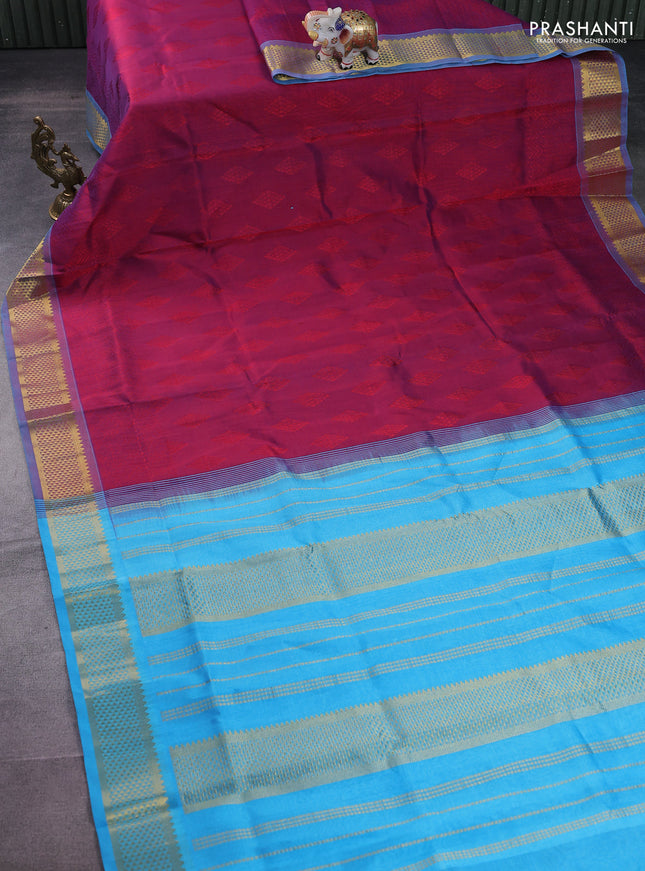 Silk cotton saree dual shade of maroon and blue with allover self emboss jacquard and zari woven border