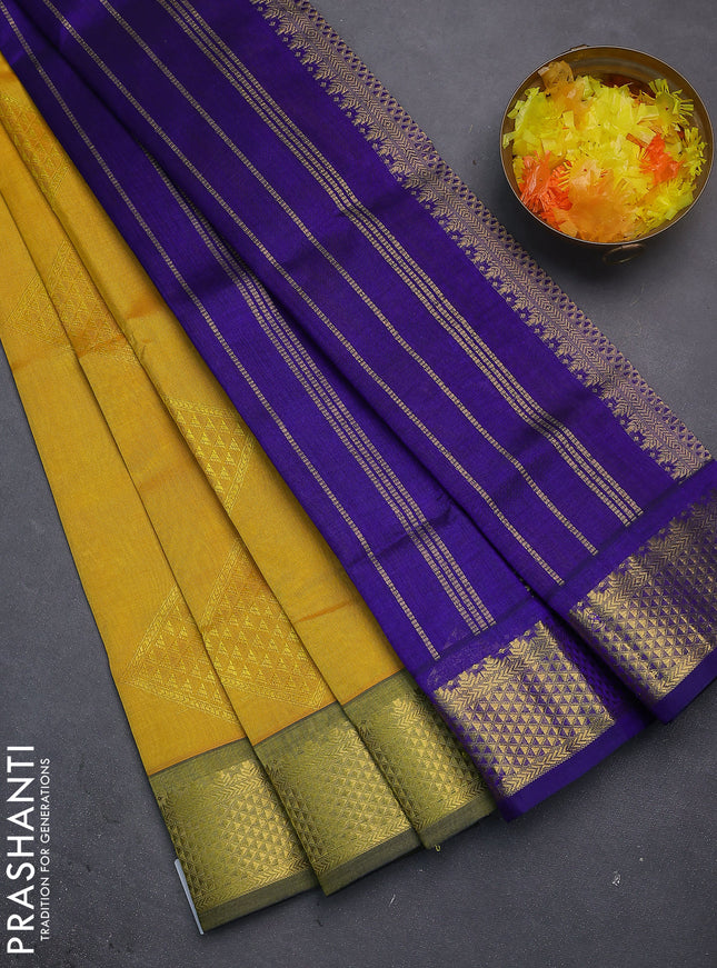 Silk cotton saree yellow and blue with allover self emboss jacquard and zari woven border