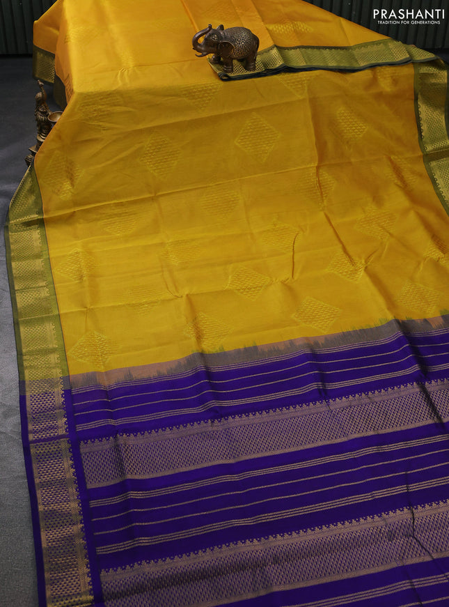 Silk cotton saree yellow and blue with allover self emboss jacquard and zari woven border