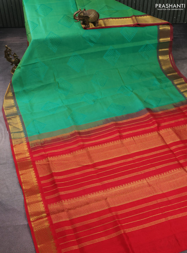 Silk cotton saree green and red with allover self emboss jacquard and zari woven border